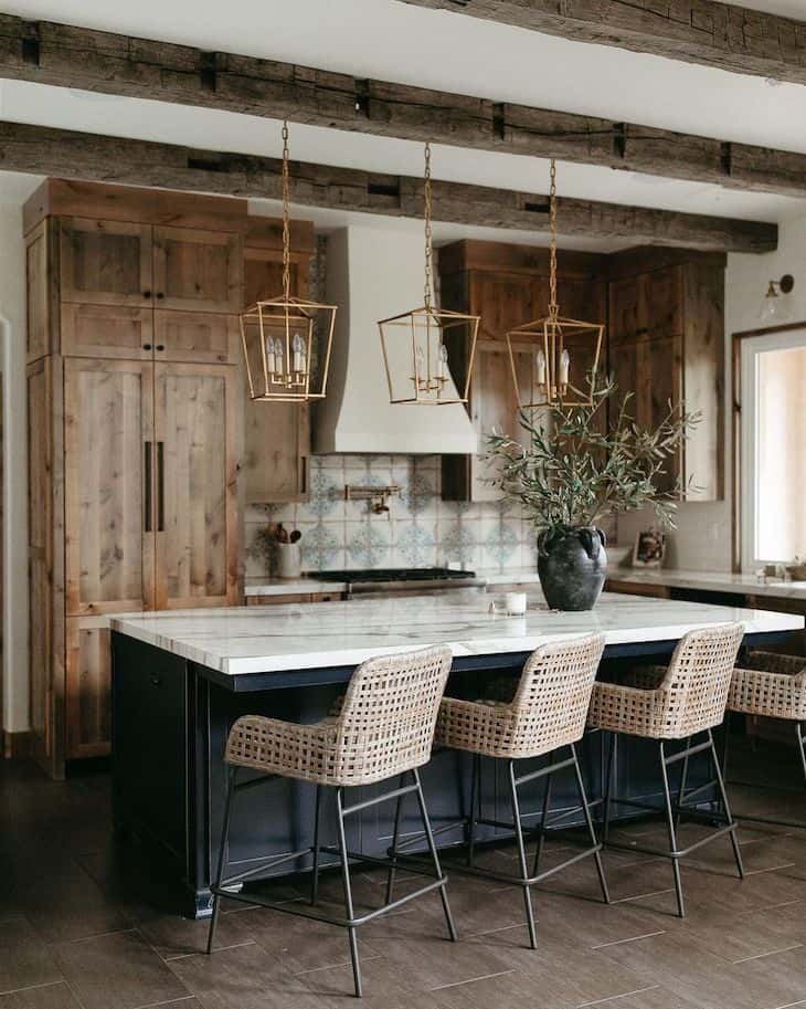 Rustic luxury kitchen with stained wood cabinets and black island