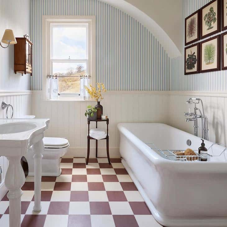 Burgundy and white checkerboard floor in bathroom