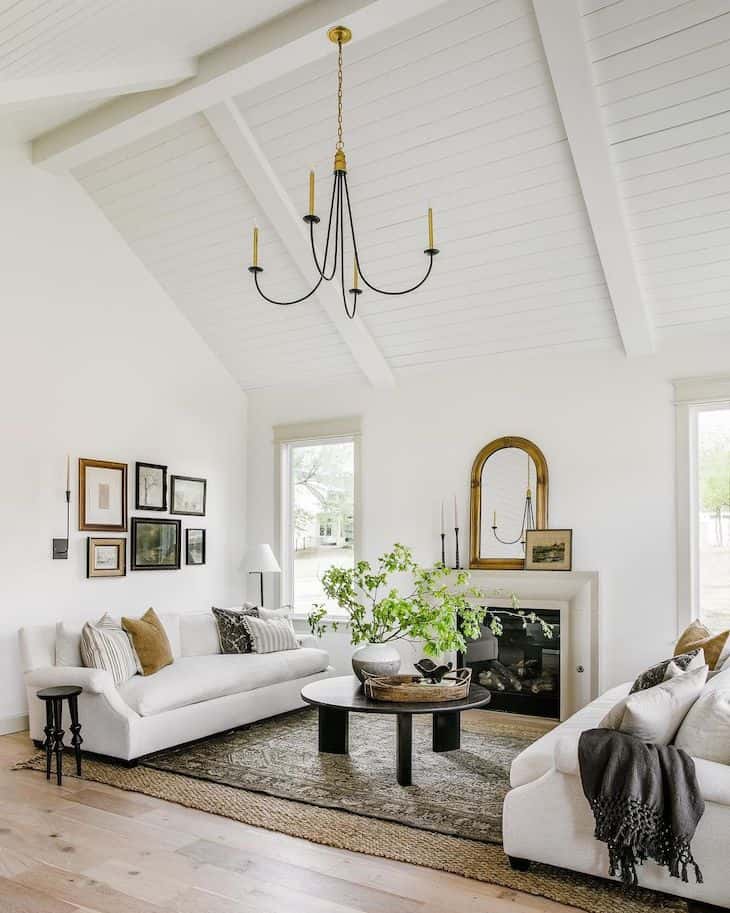 Modern traditional living room chandelier with antique gold accents and black finish