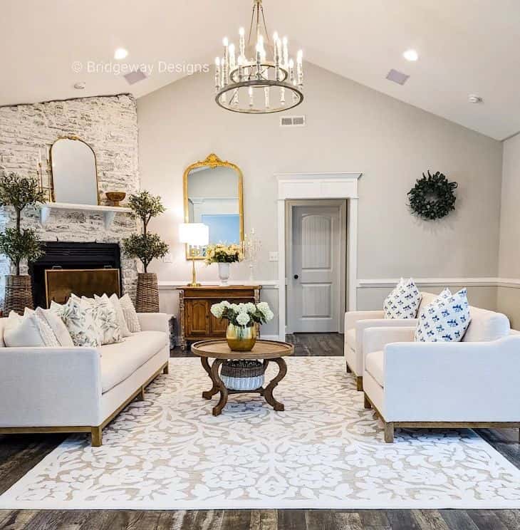 Rustic chandelier in a living room with corner fireplace