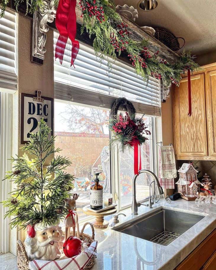 Christmas decor around kitchen sink