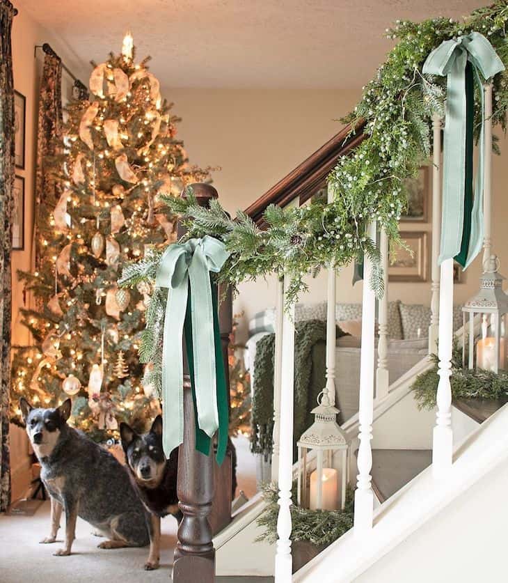 christmas staircase decor with mint ribbons and garland