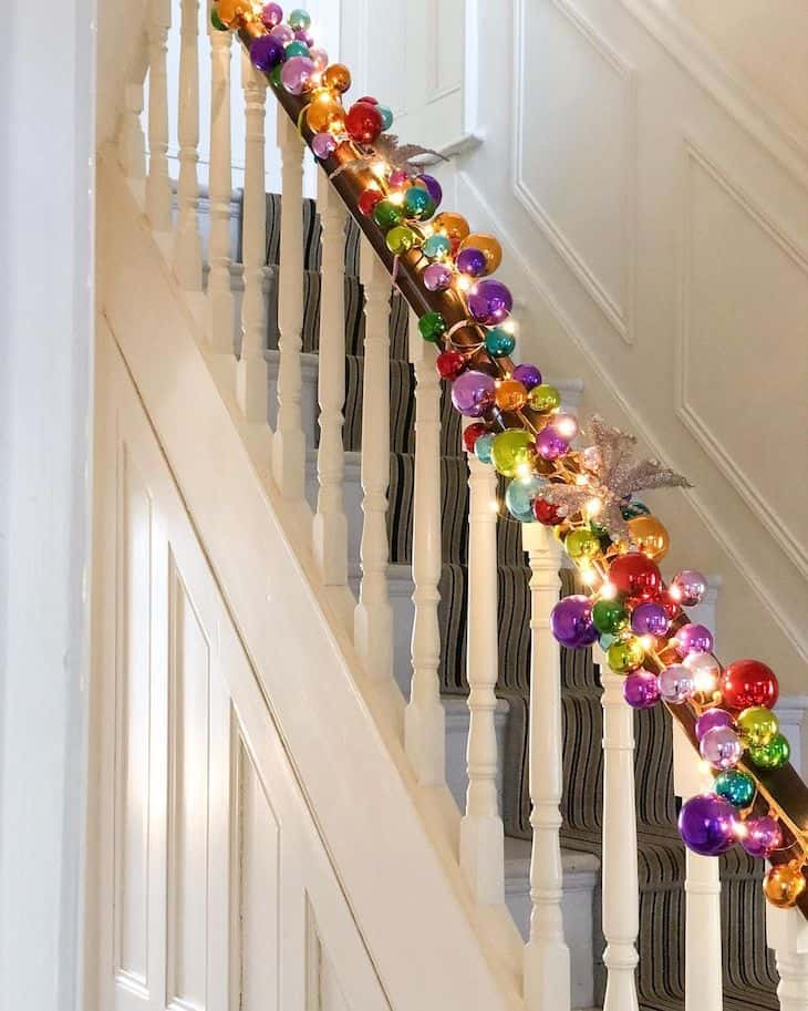 christmas staircase decor with ornament garland