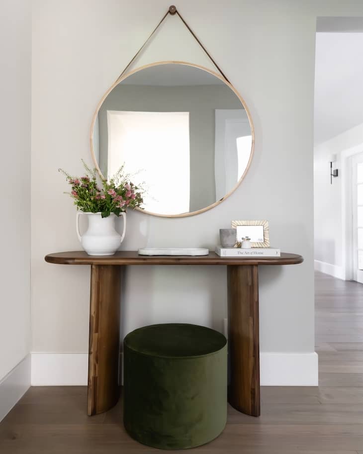 Small Space Console Table Idea with Round Mirror and Velvet Stool