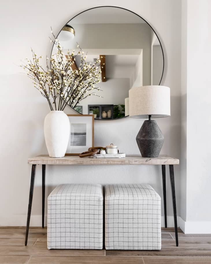 Minimal Console Table Styling with Floral Branches and Textured Lamp