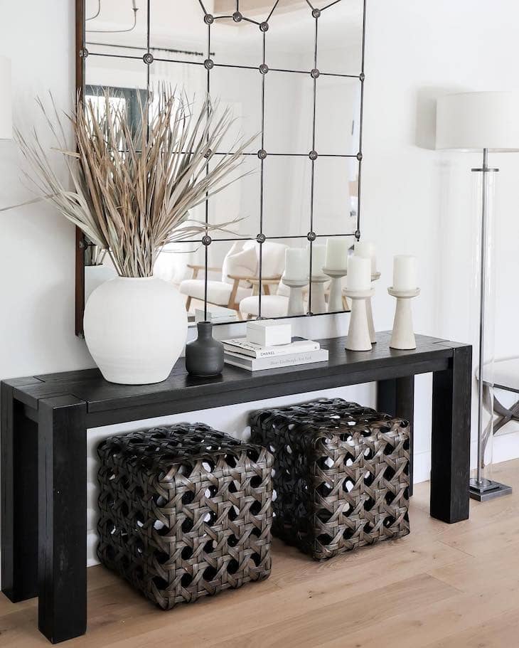 Black Console Table with Natural Textures and Decorative Lighting