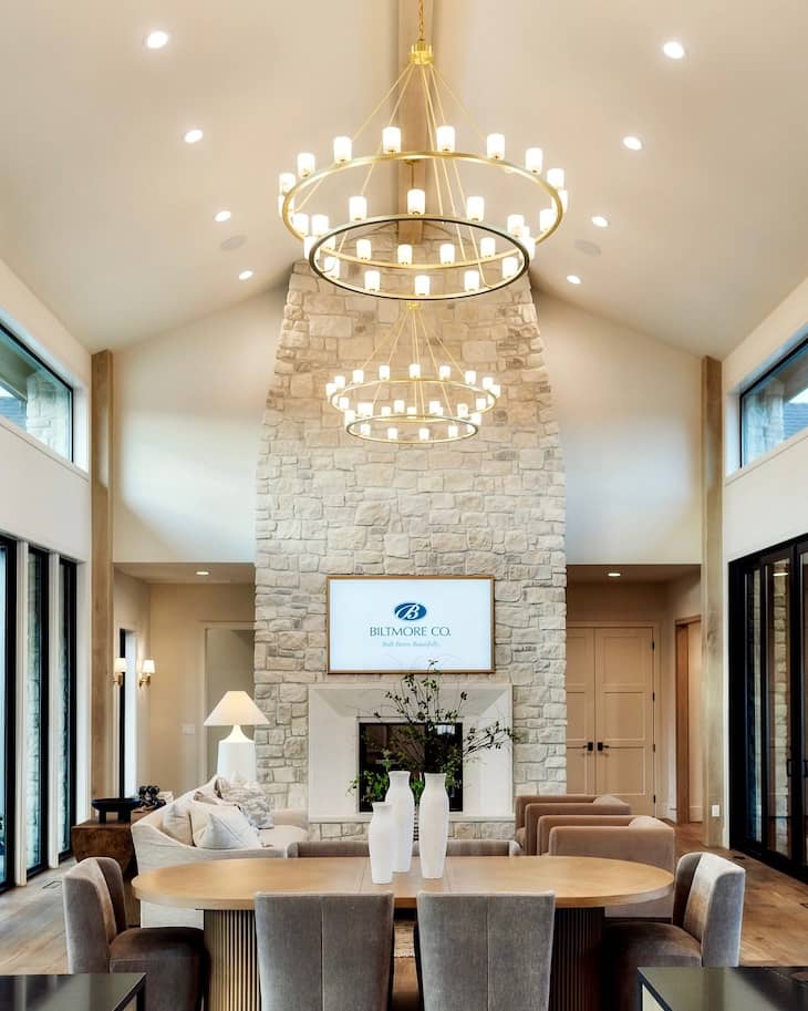 Tapered Natural Stone Fireplace with Grand Vaulted Ceilings