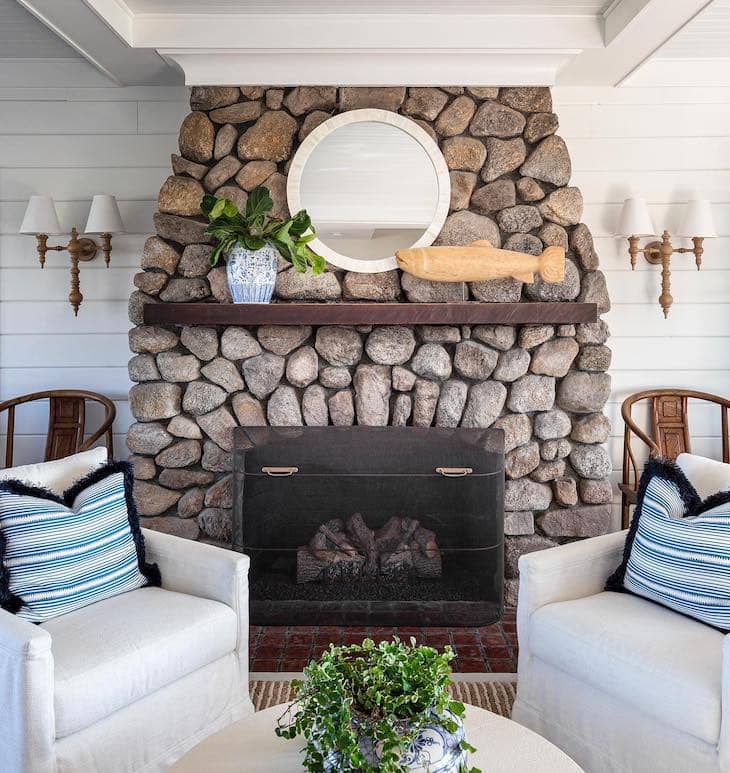 Rounded River Rock Fireplace with Coastal Touches