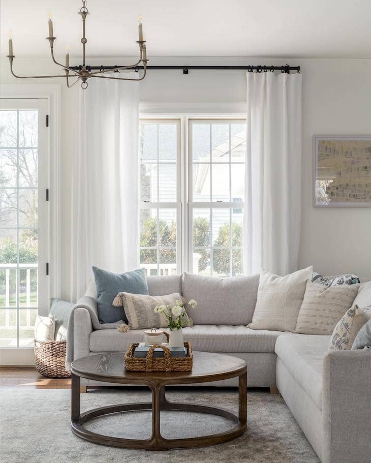 White Living Room with Rustic Wood Coffee Table and Neutral Sectional
