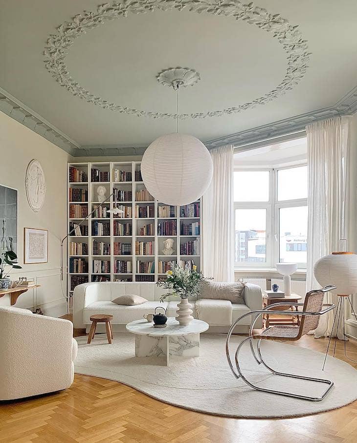 White Living Room with Architectural Details and Book-Filled Charm