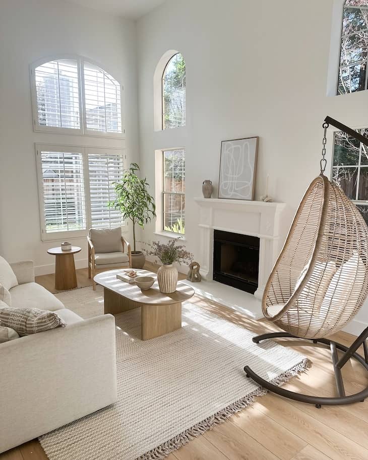 Airy White Living Room with Natural Light and Woven Hanging Chair
