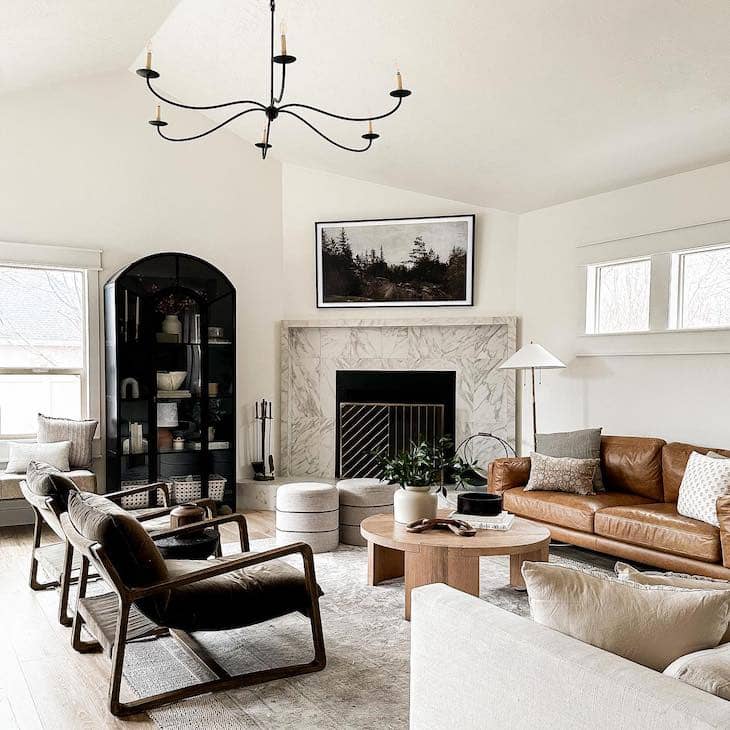 White Living Room with Leather Sofa and Marble Fireplace