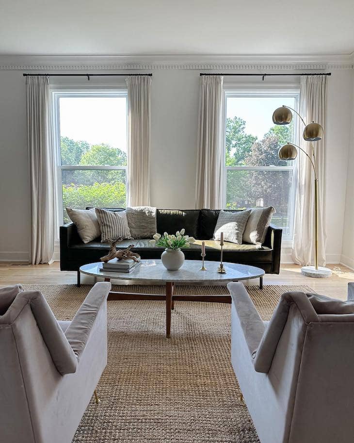 living room with black leather sofa