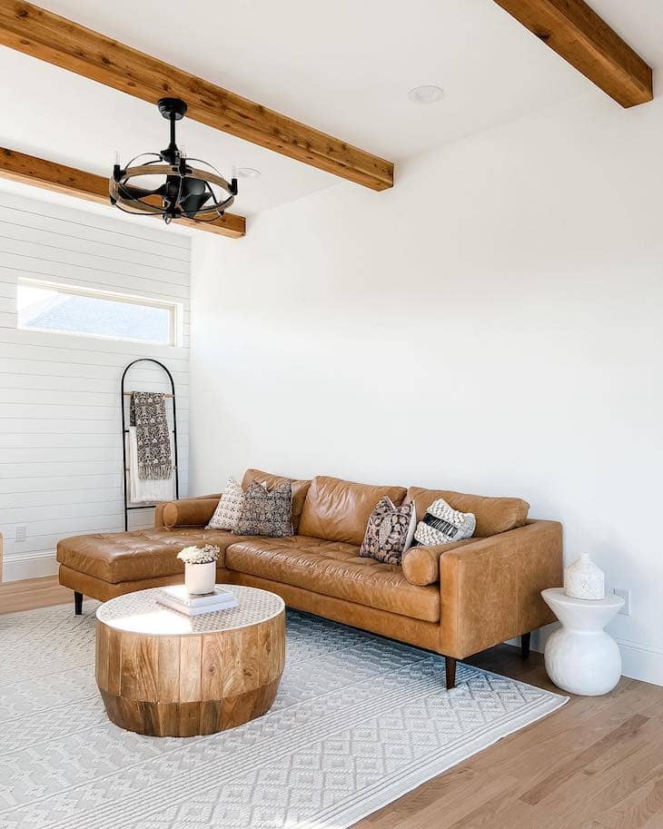 living room with leather sectional sofa