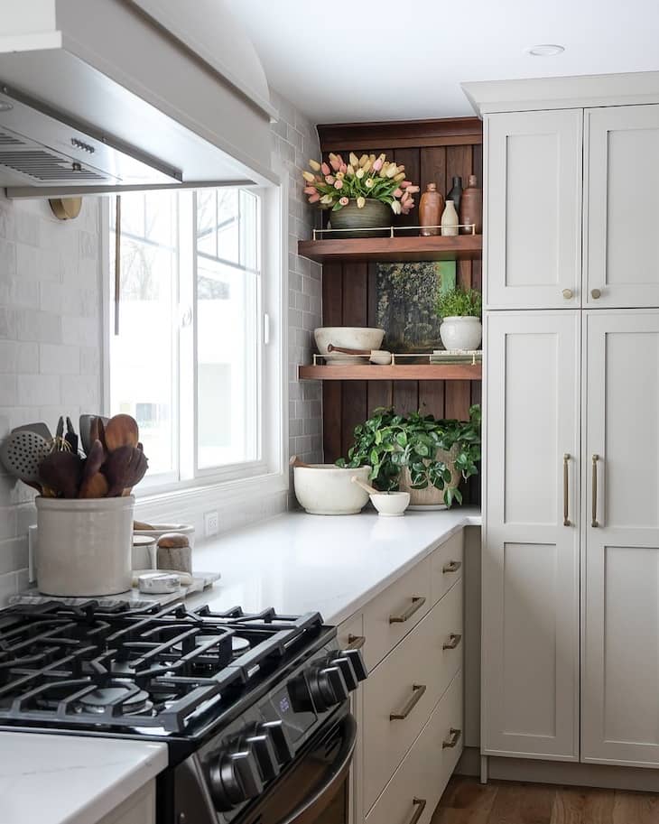 Warm Wood Accent Shelves in a Neutral Kitchen