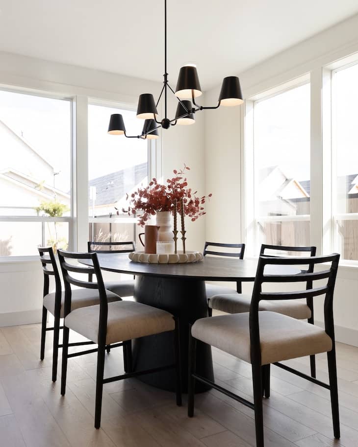 Modern Black Round Table With Light Upholstered Chairs
