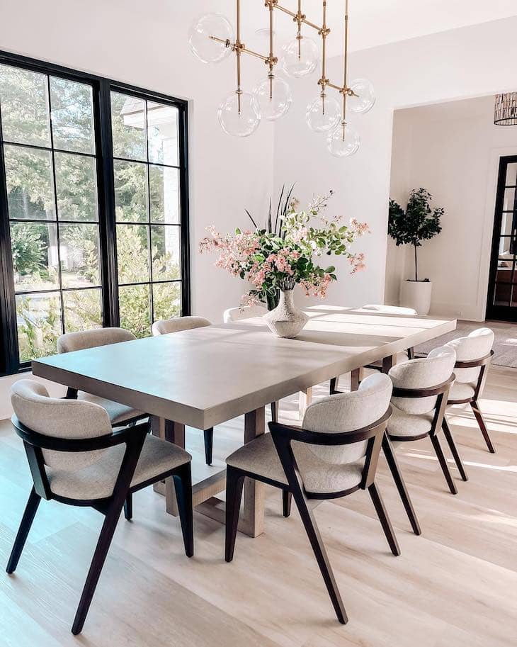 Light Concrete-Style Dining Table With Modern Curved Chairs