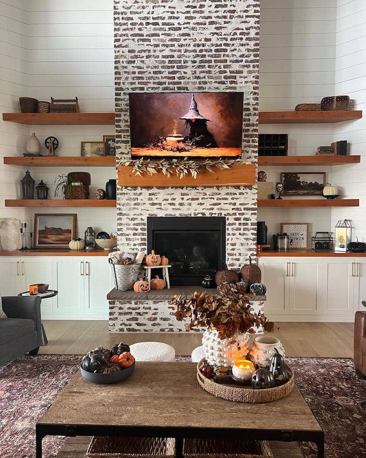 Whitewashed Brick Fireplace with Floating Wood Shelves