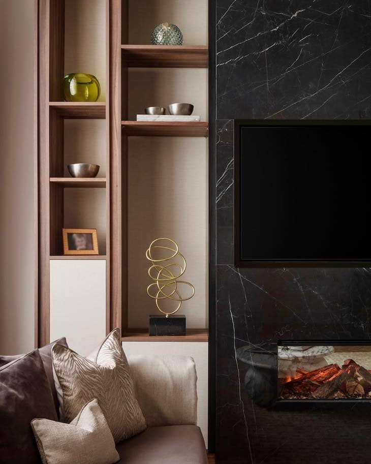 Slim Wood Built-Ins with Black Marble Fireplace