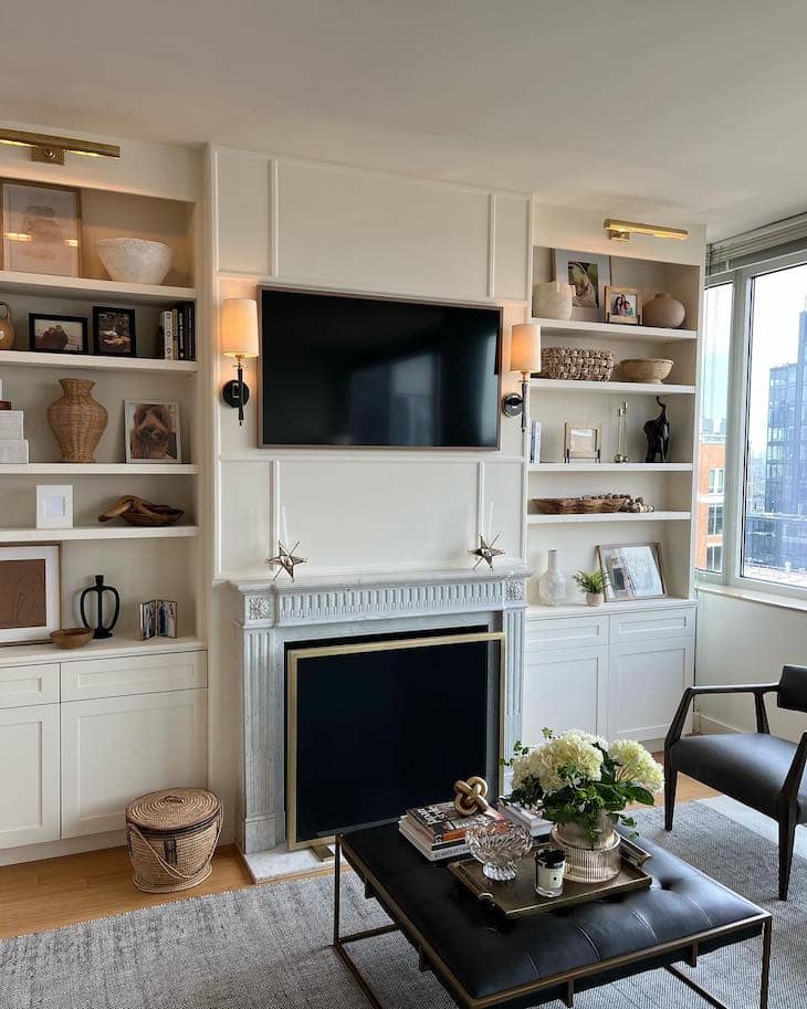 Cream Built-Ins with Marble Fireplace