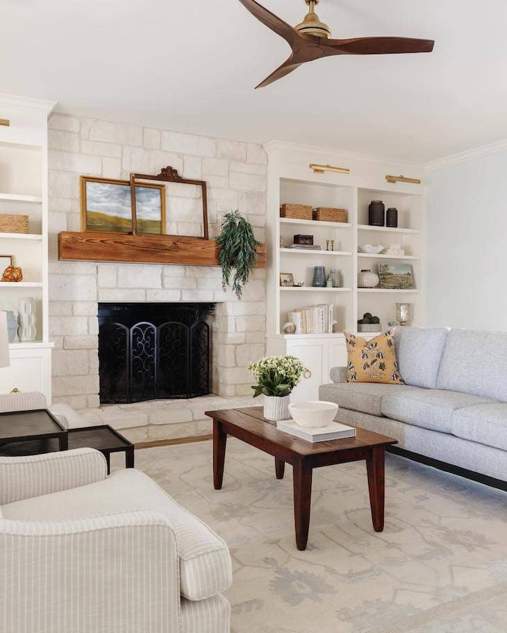 White Built-Ins with Stone Fireplace and Wood Accents
