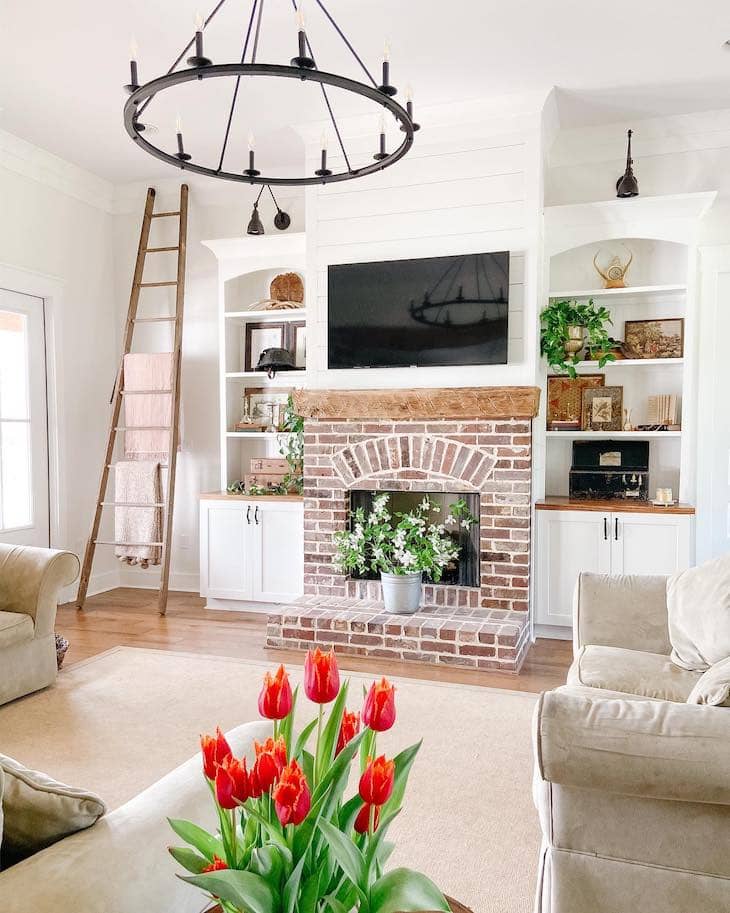 White Farmhouse Built-Ins with Brick Fireplace