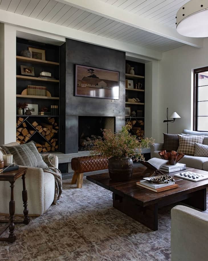 Dark Built-Ins with Industrial Fireplace Surround