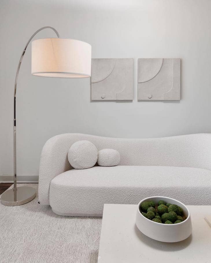 Minimal Art Pair Above the Curved Sofa