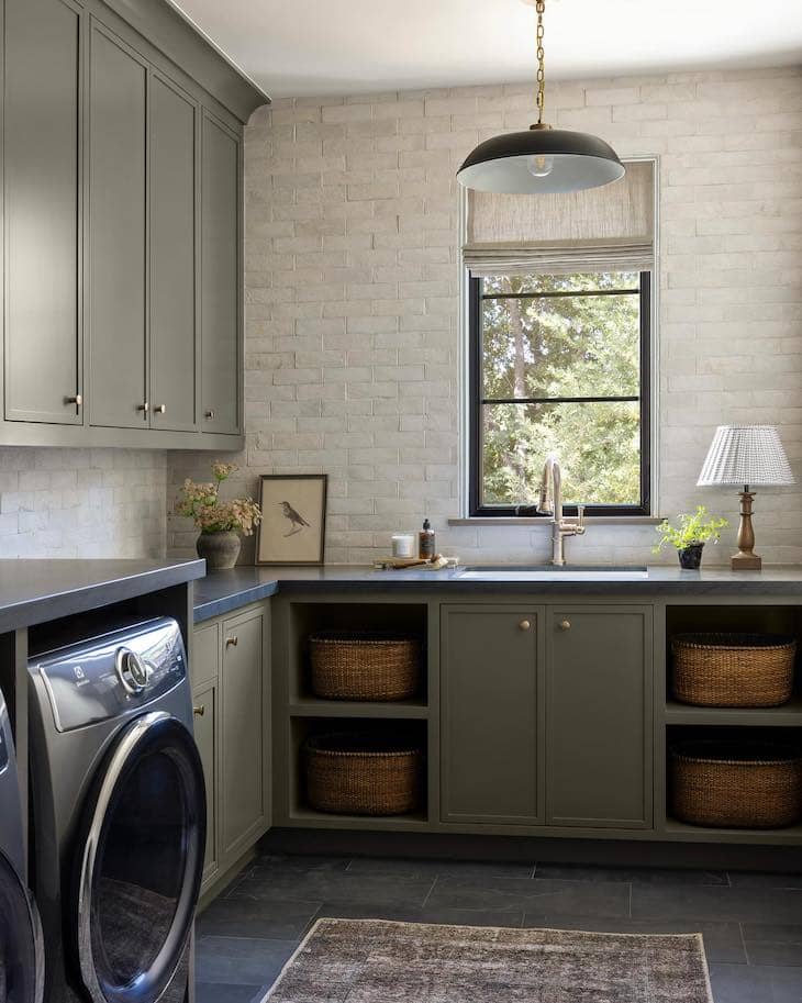 Warm Cabinetry and Basket Storage in the Laundry Room
