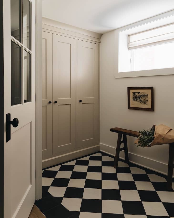 Classic Checkerboard Flooring in a Cozy Mudroom