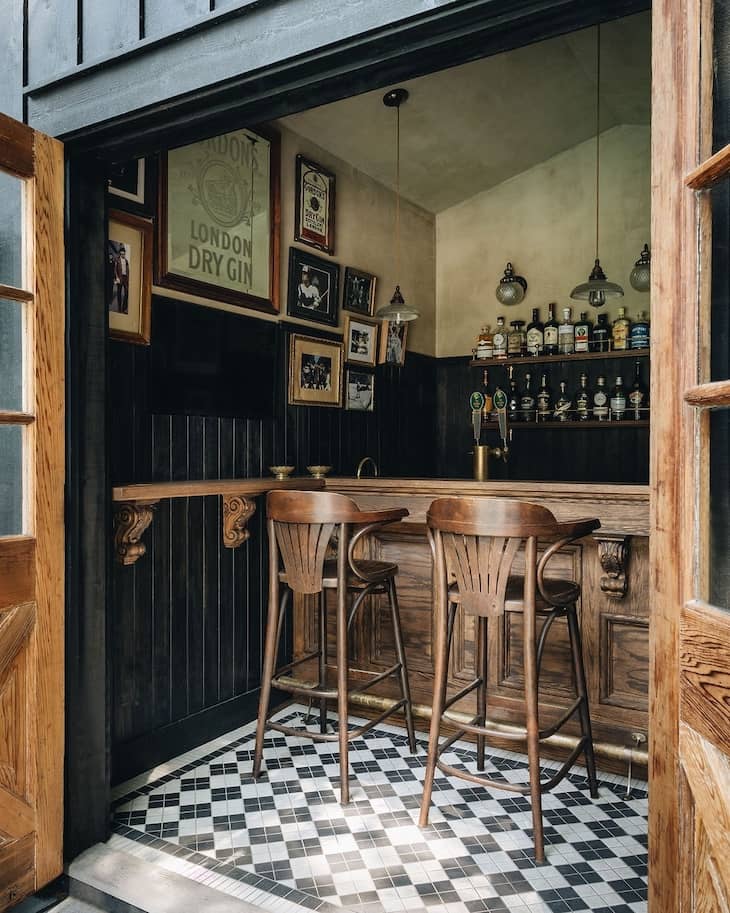 Intricate Checkerboard Tile in a Moody Home Bar