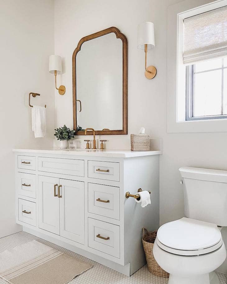 Clean White Vanity With Warm Gold Accents