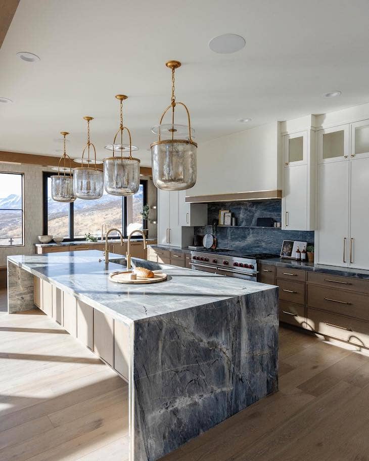 Dark Stone Countertops With a Waterfall Island