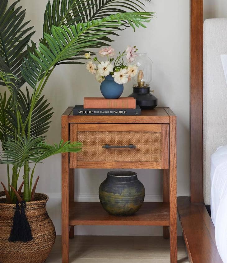 Layered Nightstand Decor with Books and Florals